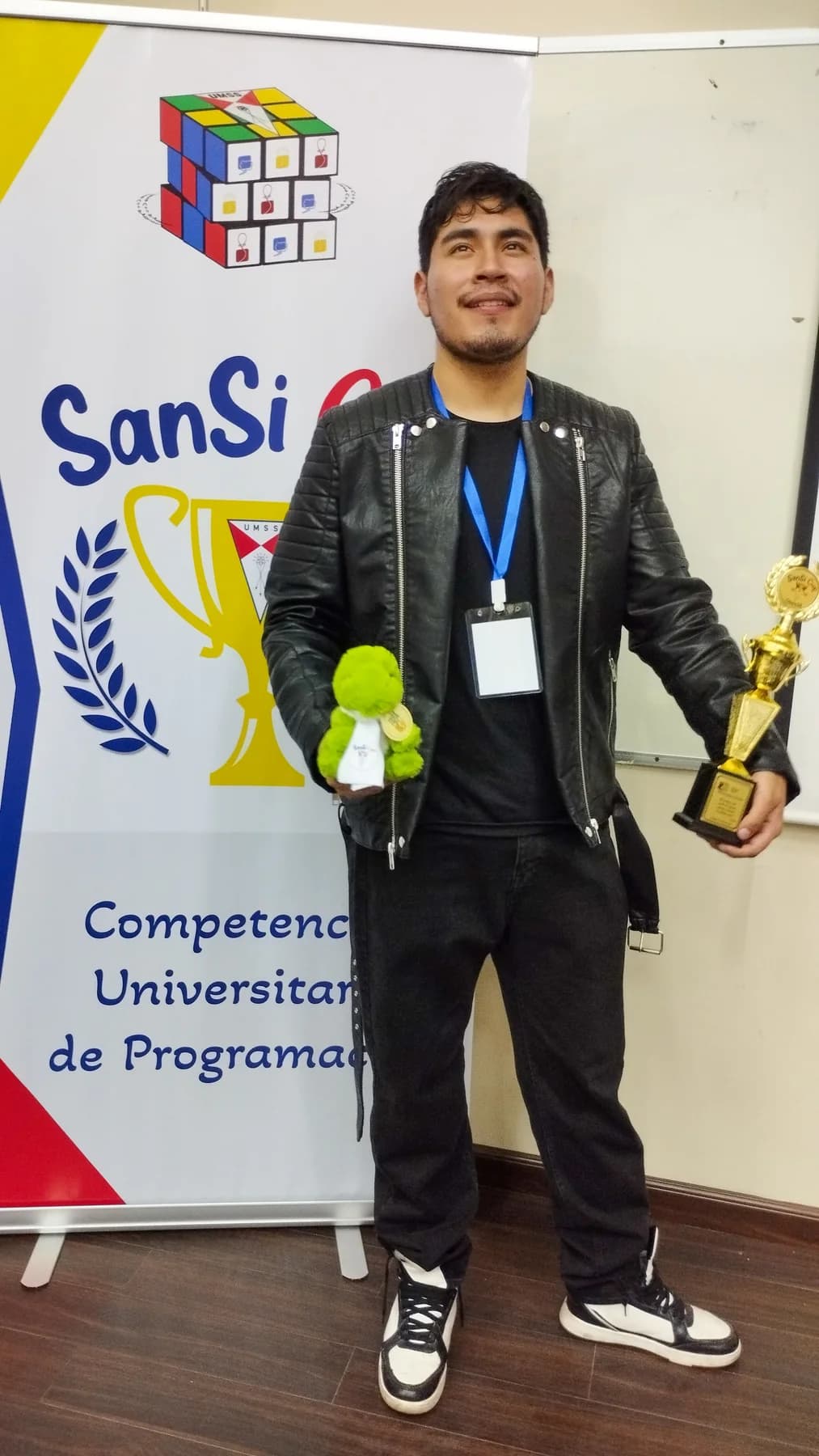 Nicolas Alba holding the SanSi Cup first-place trophy